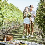 a couple in Mersea Island Vineyard ready for a picnic, Things to do on Mersea Island this summer